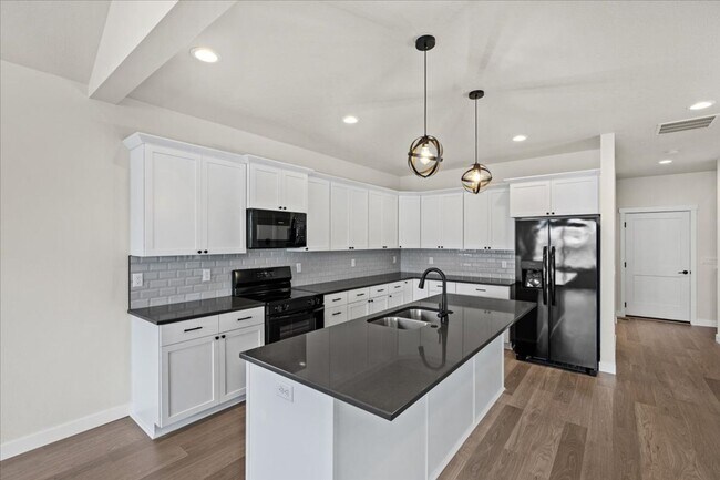 Building Photo - Brand New, Stylish 4-Bedroom Home with Vaulted Ceilings and Private Patio