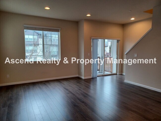 Building Photo - 3 Level End Unit Townhome with Newer Carpet, Open Floor Plan, 2 Balconies, 2 Car Attached Garage ...