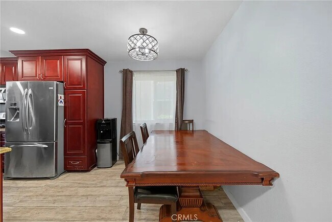 Building Photo - Bright 2-Bed Condo with Central Air, Pool Access & Carport in Anaheim