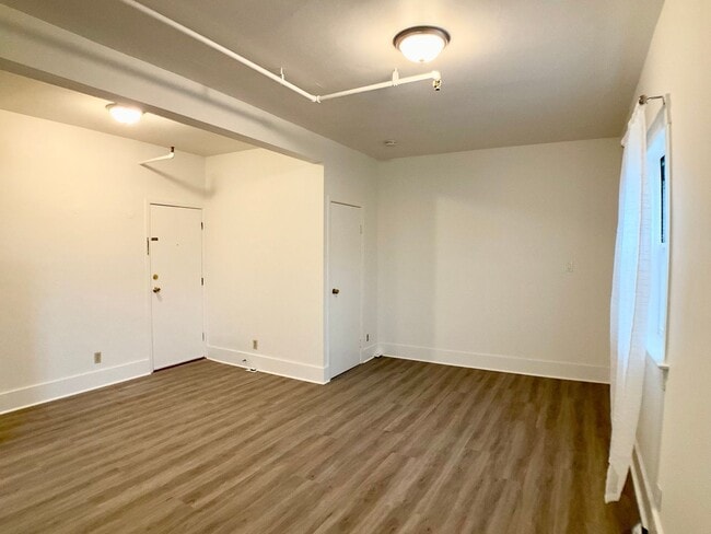 Building Photo - RENOVATED and Private. DISHWASHER, ON-SITE LAUNDRY, HARDWOOD!