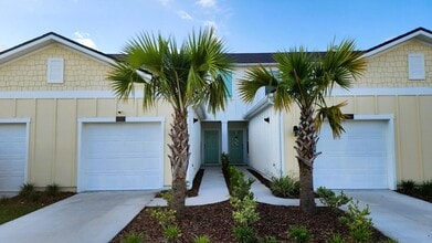 Building Photo - Beautiful Townhome in Waterford Lakes 2 Bedroom 2.5 baths and 1 Car Garage