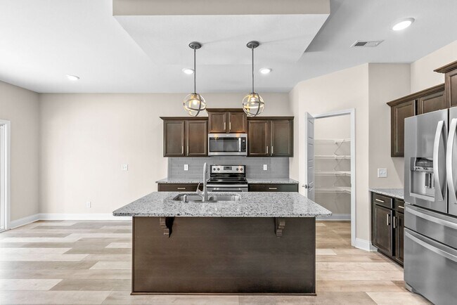 Building Photo - Pet Friendly Three Bedroom with Bonus!