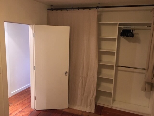 2nd bedroom, w/ closet system + curtain. - 285 Washburn Ave