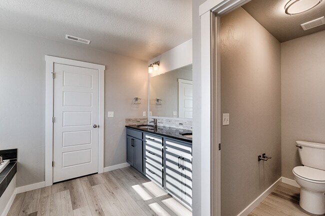 Building Photo - Custom Hunter-Douglas shutters throughout.