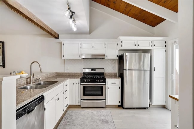 Building Photo - Spacious 1,550 Sq Ft Townhome | 2-Car Garage & High Ceilings w/ Exposed Beams