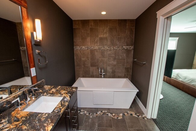 Building Photo - Experience Elevated Living with West Bay V...