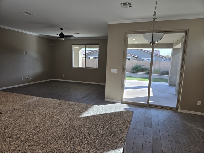 Living/dining view from kitchen - 19975 W Glenrosa Ave