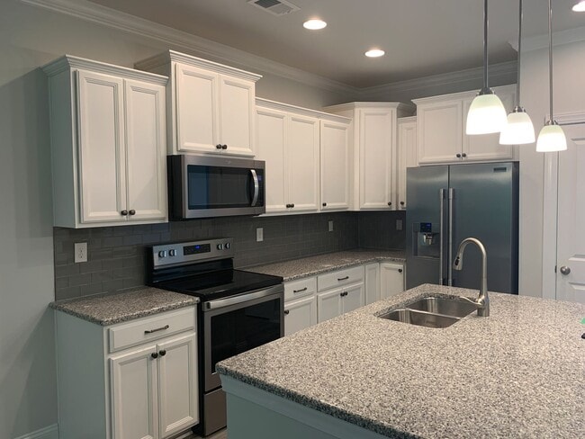 Building Photo - 4 Bedroom, 2.5 Bath, Pet Friendly Town Home with Garage Within Barefoot Resort and Golf! Availabl...