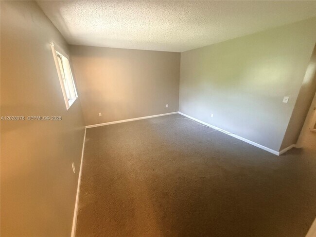 Building Photo - 10787 Royal Palm Blvd