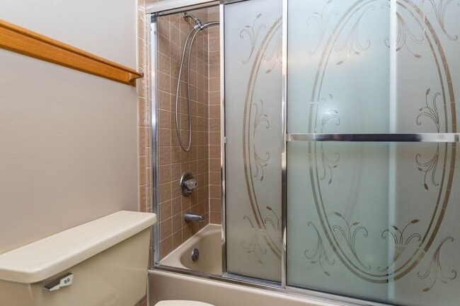 Building Photo - Cozy 2-Bed Condo with Fireplace, Garage & Pool Access Near Shopping!