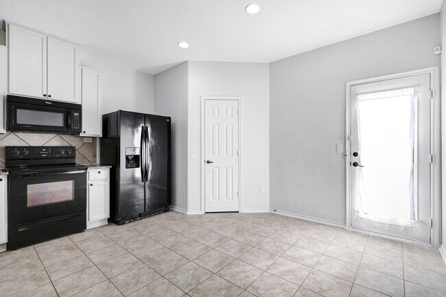 Building Photo - ***MOVE-IN SPECIAL: ONE WEEK FREE***Luxurious Move-In Ready Home with Versatile Living Spaces