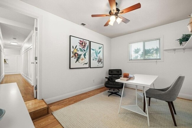 Building Photo - Welcome to this stunning 4-bedroom, 2-bath...