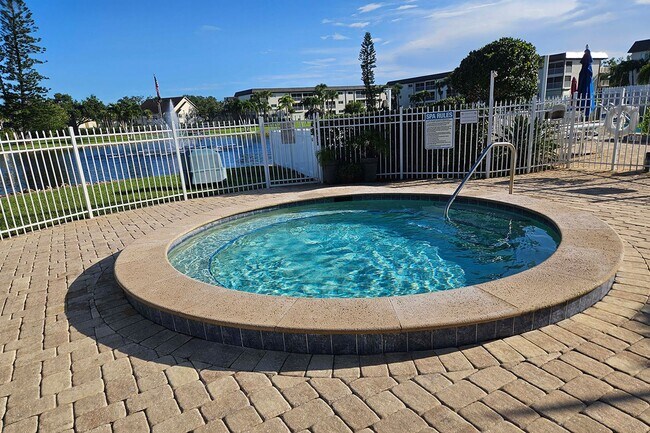 Building Photo - AVAILABLE NOW! Furnished Ground-Floor End Unit | Lake & Pool Views | Minutes to Marco Island & Do...
