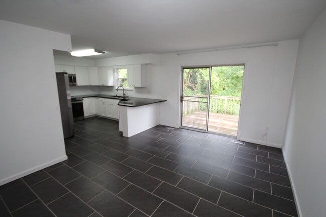 Building Photo - *Coming Soon*  Upgraded End Unit Townhome ...