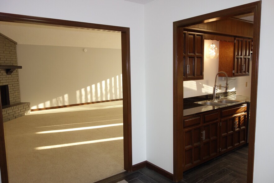Front entry with view of living room on left and kitchen on right - 3324 E 73rd St