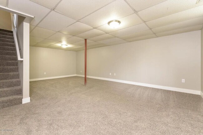 Building Photo - Spacious 3BR Duplex with Finished Basement & 2-Car Garage in Otsego