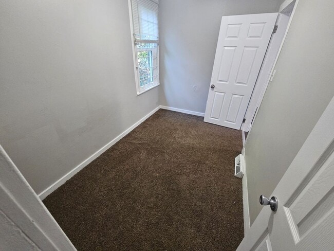 Building Photo - Spacious 4-Bedroom Cleveland Home with Updated Flooring & 2-Car Garage