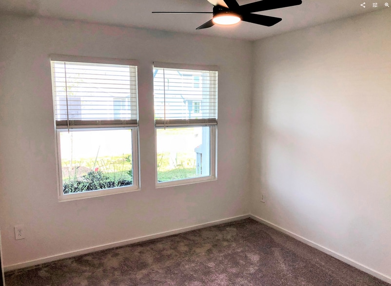 Bedroom 1 with light-adjusting fan - 16472 Blossom Grove Dr