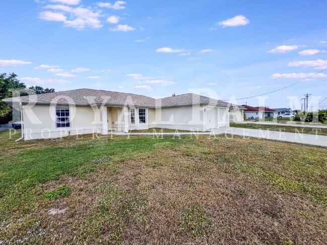 Building Photo - New Year, New House? 3BR/2BA Lehigh Acres Home with Garage, Lawn Care, and Big Main Character Energy