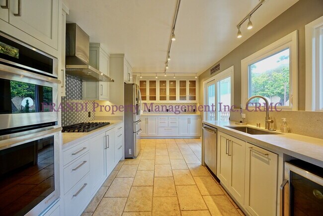 Building Photo - Bright and Inviting 4BR Home Minutes from ...