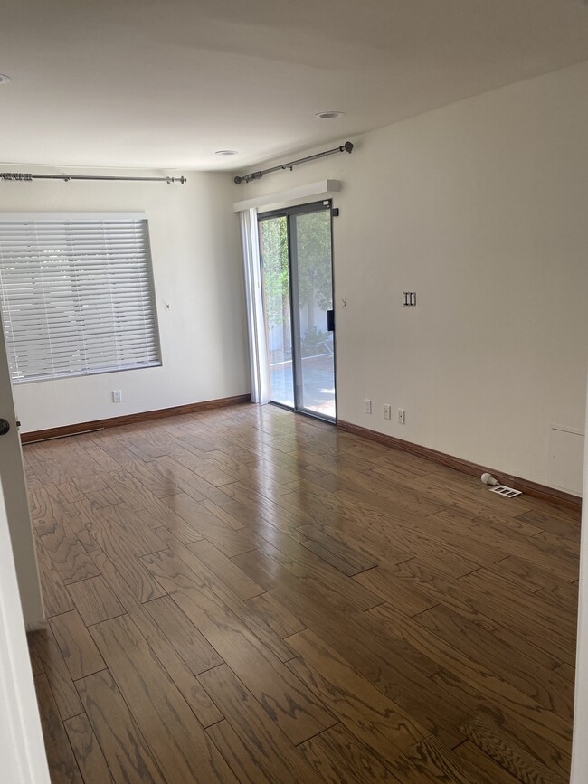 Family room with hard wood floors - 125 N Oakhurst Dr