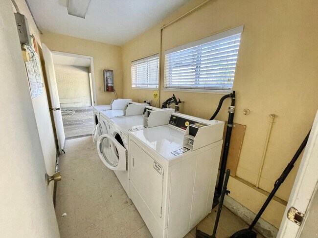 Building Photo - Sunlit 2BD/1BA w/ Private Balcony + Backyard! New Carpet! Assigned Parking! PROGRESSIVE