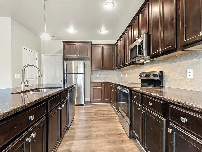 Building Photo - Earn Wealth While Leasing - Like a Homeown...