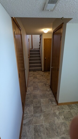 Garage, front stairs, closets - 245 SW Chartwell Pl