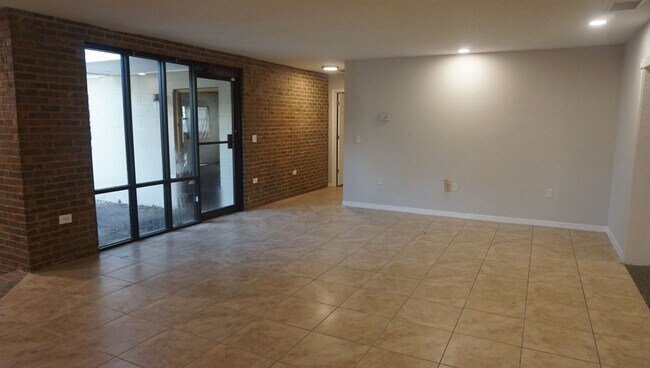 Building Photo - Four Bed - Three Bath - Large Storage Area...