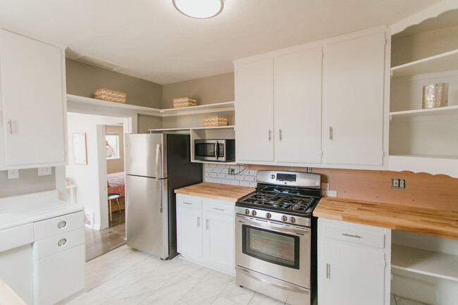 This picture was taken before the backsplash was complete. It is now. - 2614 Wood Ave