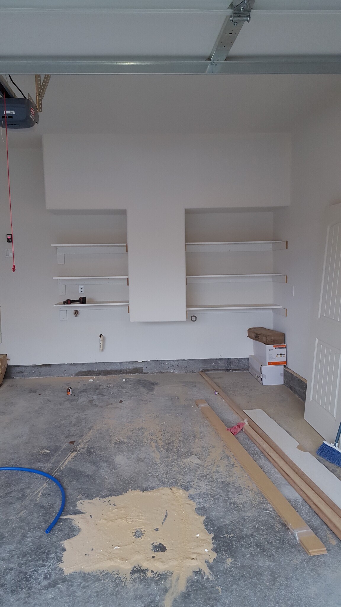2 car garage with extra storage shelves, electric door opener w/ keyfobs, and keypad entry. - 1121 Sundial Ln