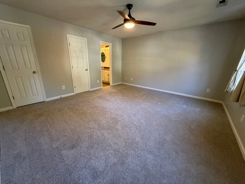 The Priimary Bedroom suite includes great wall space for furniture and a King size bed - 6419 Woodmont Rd