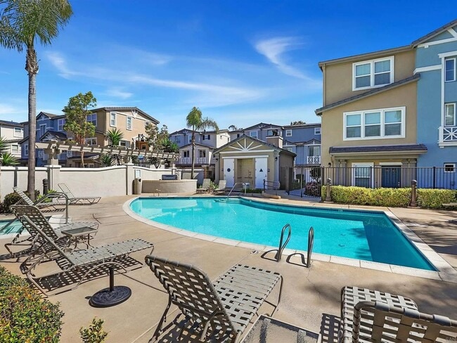 Building Photo - Modern 3-Story Townhome in Bay Park – 3BR/3.5BA with Pool, Balcony & In-Unit Laundry