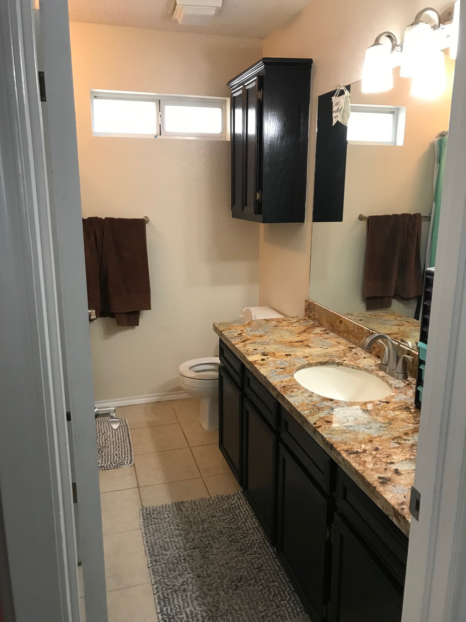 Master bathroom with walk in closet and walk in shower. - 1801 Lexington Circle