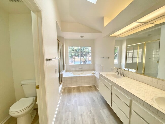 Building Photo - NEW PRICE! Spacious 3bdrm 2.5bath Condo w/2 car garage & private laundry hookups, community Pool ...