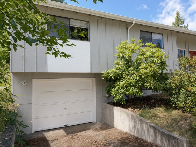 Building Photo - Beautiful Split-Level Home with Fireplace, Deck, Garage, and EV Charger