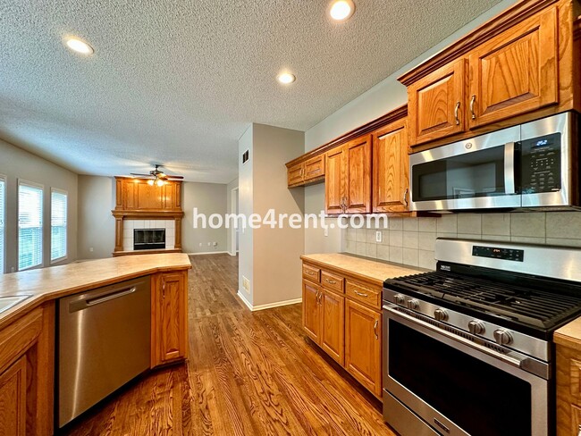 Building Photo - Beautiful Four-Bedroom Home with Three Car Garage, Wood Floors, Finished Basement and a Fenced Ya...