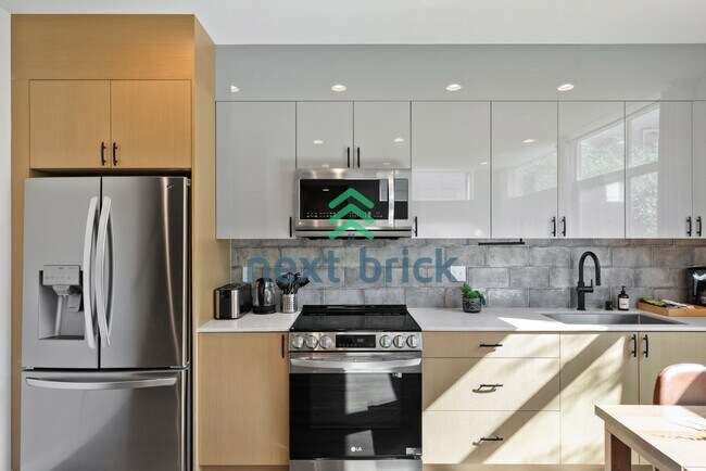 Building Photo - Offer: Unfurnished option available at $3,250, with an optional furnished package for an addition...