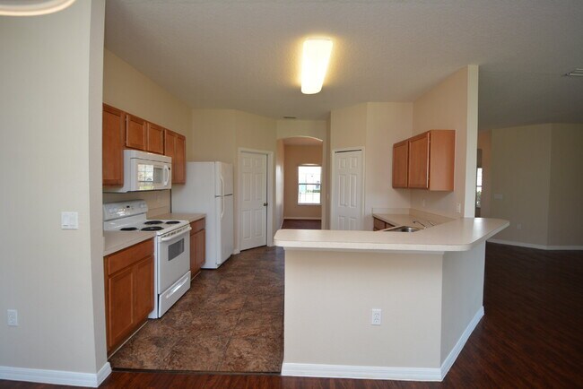 Building Photo - "Spacious 4-Bed Oasis in Palm Coast with 2...