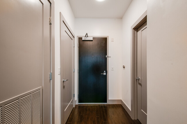 Entry way with secure bolt lock and Nest thermostat. - 2407 8th Ave S