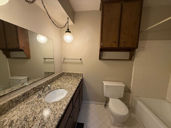 Building Photo - Three bedroom duplex with vinyl flooring. ...