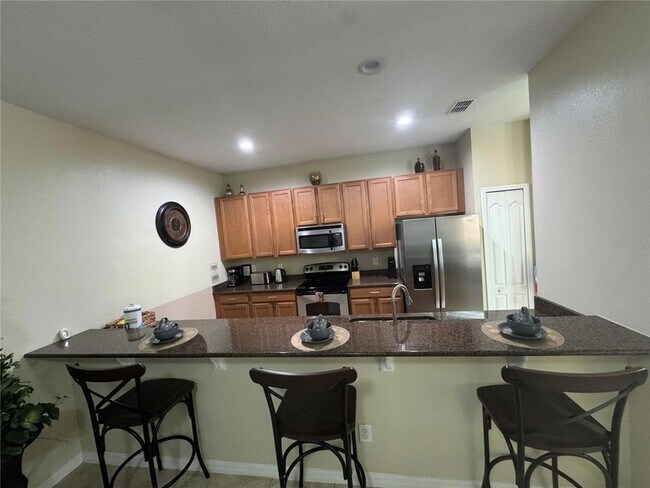 Building Photo - 8977 Coco Palm Rd