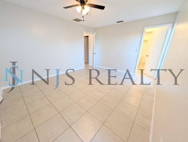 Building Photo - Beautifully updated 3/2/2 1500 Sq. Ft. with fenced yard, tile floors, HUGE living room and a corn...