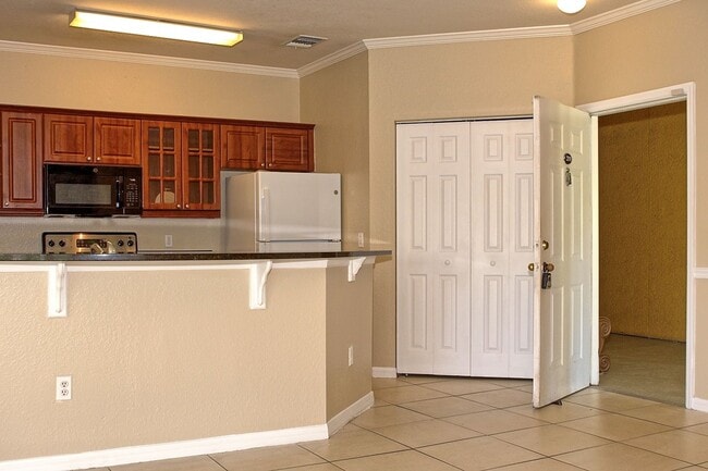 Building Photo - Spacious 2 bed 2 bath condo, split floorplan on the 3rd floor! Gated community at Mosaic at Millenia