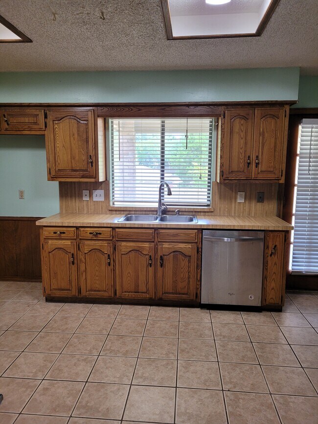 Kitchen looks into backyard - 706 S Forest Ln