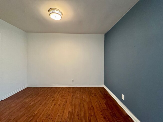 Building Photo - Updated Lower apartment with Hardwood Floo...