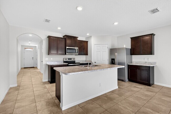 Building Photo - Renovated 4 Beds 2 Baths Single Family on Over a QTR Acre lot | Huge Yard