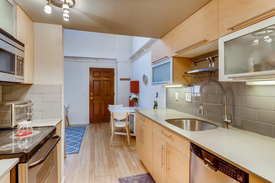 Kitchen with view towards living room and front door - 1085 Broadway St