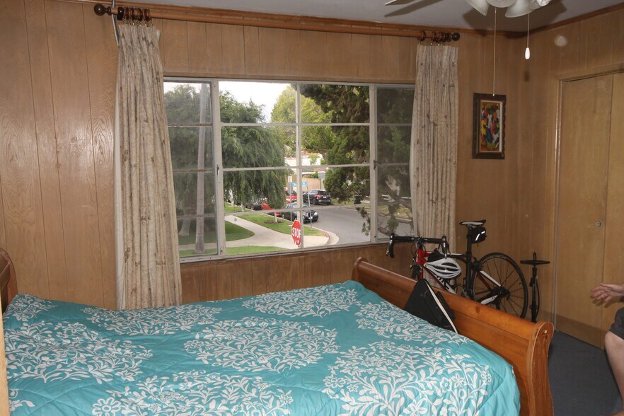 Paneled room, big bay window facing East - 11061 Missouri Ave