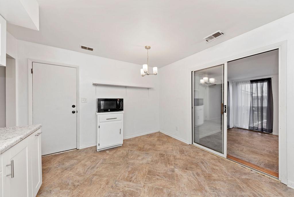 Beautiful, updated kitchen with glass front cabinets and tons of storage! All appliances - including range, refrigerator, dishwasher and microwave. Kitchen opens to Sunroom, charming patio and fully fenced back yard. - 11 Lawndale Ave